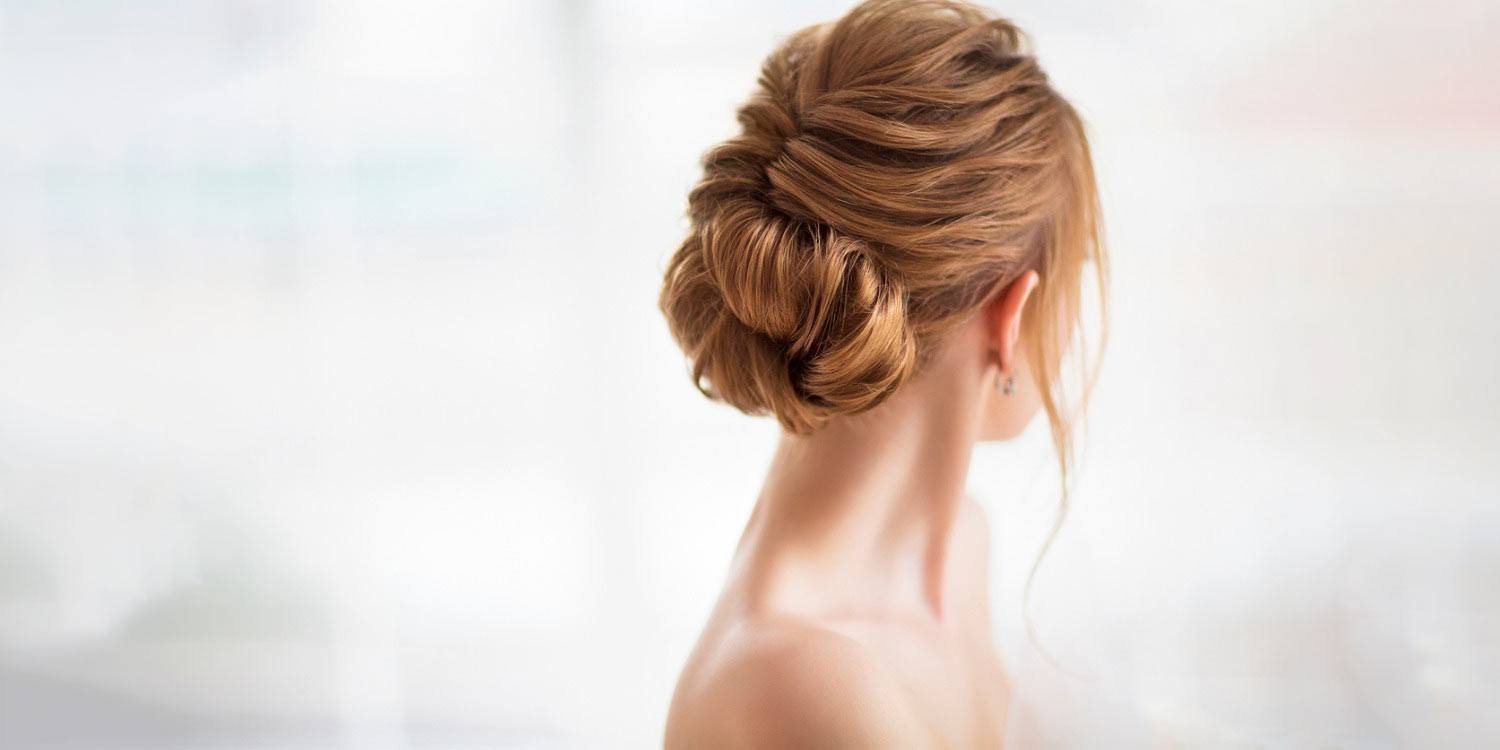 Image of Low bun with a few loose strands for Valentine's Day